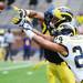 Michigan wide receiver Joe Reynolds has the ball knocked from his grasp by defensive back Delonte Hollowell during spring practice at Michigan Stadium on Saturday, April 13, 2013. Melanie Maxwell I AnnArbor.com